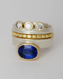Three band 'Stacking Ring' with Large blue Sapphire and three white Sapphires.